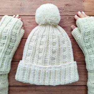 Crochet beanie hat with pom pom and fingerless gloves patterns for women includes instructions, photos, diagram and video.