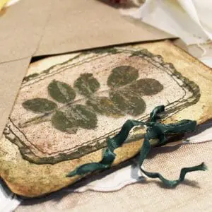 Handmade postcard with pressed leaf