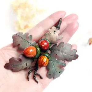 The brooch «Oak twig with acorns»