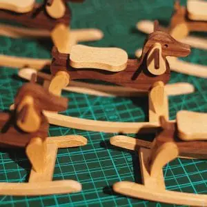 Miniature Dachshund rocking chair for dollhouse
