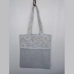 a bag with daisies