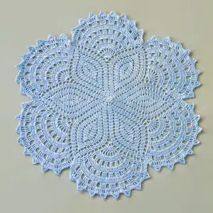 openwork round crocheted napkin