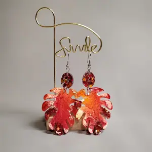 Monster leaf earrings, orange colored earrings