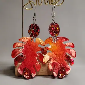 Monster leaf earrings, orange colored earrings