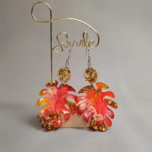 Monster leaf earrings, orange colored earrings