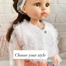 paola reina doll wearing tulle jacket and peach pants portrait