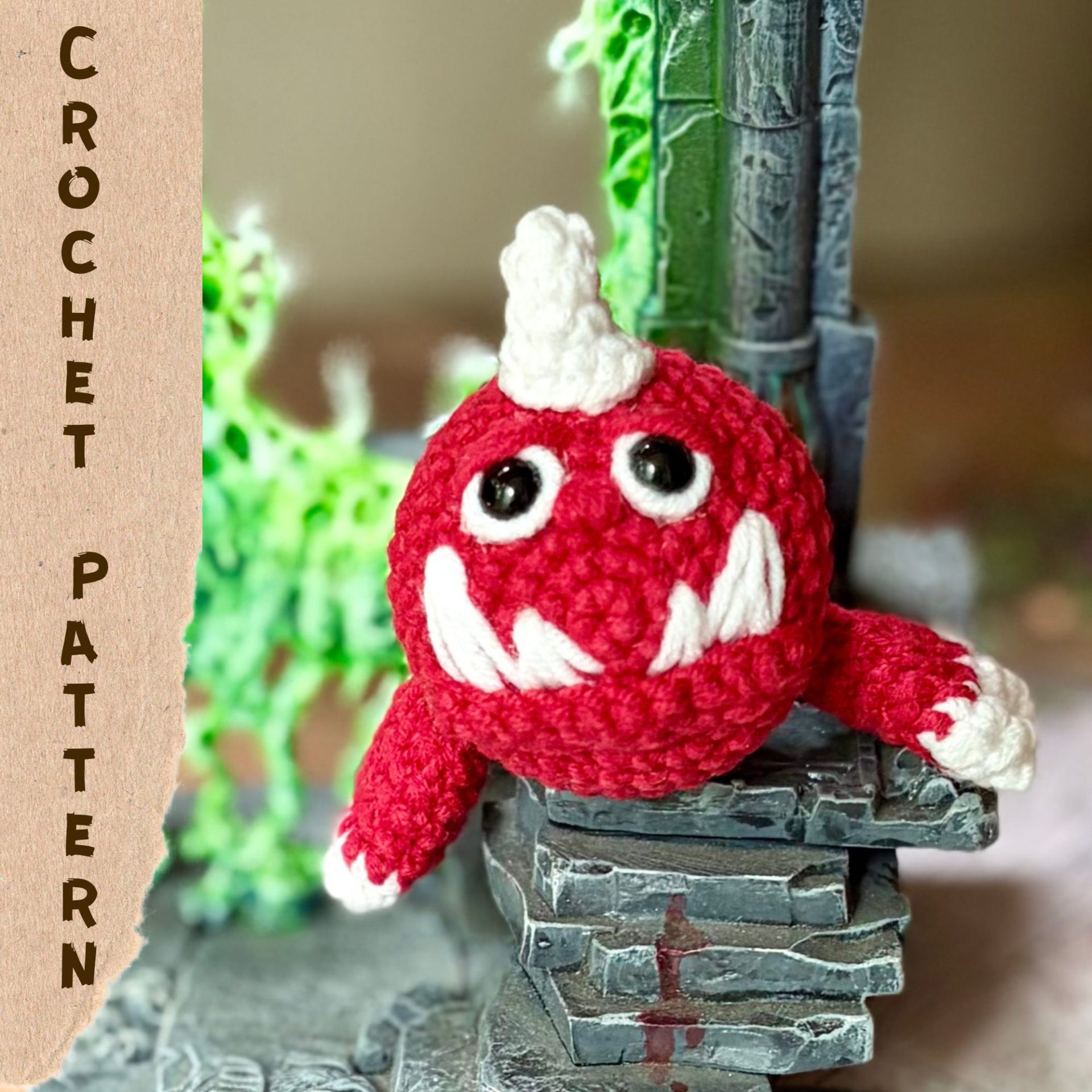 Warhammer Squig Crochet Pattern Cover Cover image for a PDF crochet pattern featuring a miniature Warhammer Squig amigurumi sitting on ruined stone scenery with a glowing green portal