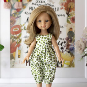 Paola Reina doll in a jumpsuit with a clover for St. Patrick's Day