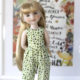 American Ruby Red doll in a clover jumpsuit for St. Patrick's Day