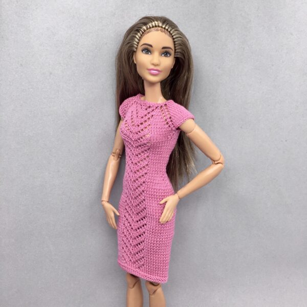 Knitted dress for a doll