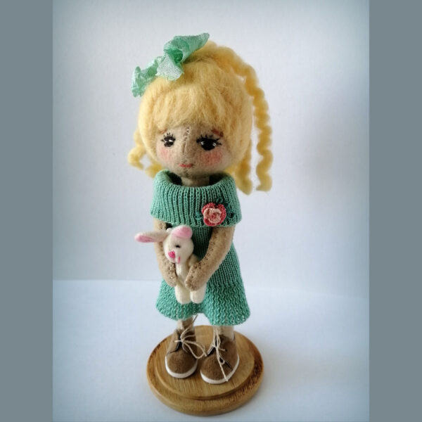 Handmade felt doll with blond hair, mint knitted dress and tiny bunny
