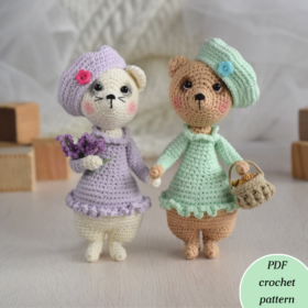 Soft toys cat and bear. Girls. Toys in dresses and berets. A cat holds lavender flowers. A bear holds a basket of croissants. The height of toys is 14 cm .