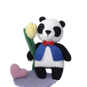 Handmade bear panda toy. The author's toy panda bear is crocheted. Cute amigurumi panda stuffed toy for a gift.