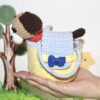Amigurumi dog pattern in a carrier bag