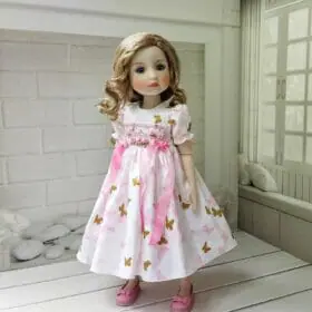 Little Darling smocked dress with pink and gold butterfly.