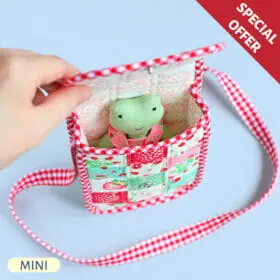 Handmade mini frog stuffed animal in patchwork bag