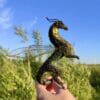Forest dragon figure on sky background