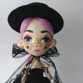 textile art doll with pink hair and tattoo