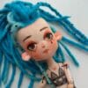 Textile boudoir doll with turquoise dreadlocks and tattoo