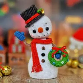 Cute snowman with christmas wreath
