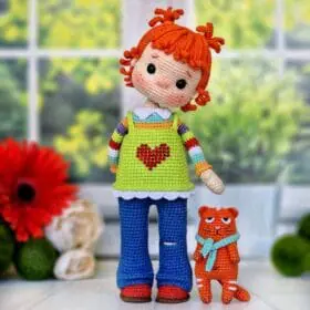 Red-haired doll girl and ginger cat