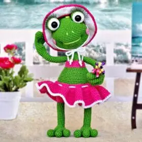 Flirty frog toy in a beach suit
