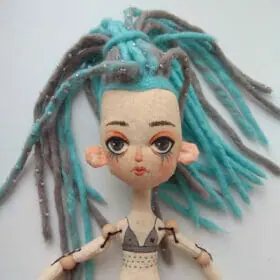Textile doll with dreadlocks and tattoo