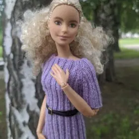 Close-up of lilac knit Barbie dress.