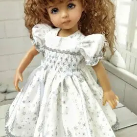 White with silver glitter smocked dress for Little Darling dolls.
