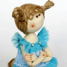 Textile handmade doll. Portrait image