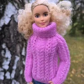 Barbie doll in right view pink knit sweater