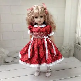 Red Christmas smocked dress with hand embroidery.