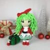 Plush crochet Christmas doll amigurumi toy, handmade holiday pattern.
