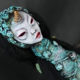 Crafted with love and a touch of darkness, this mermaid doll combines the beauty of the sea with the thrill of horror. His adorable tail, adorned with intricate details and eerie colors, will send shivers down your spine!