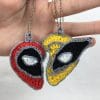 Crochet Deadpool and Wolverine heart keychain, Marvel-inspired amigurumi, handmade pattern.
