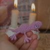 A brooch in the shape of a lizard.