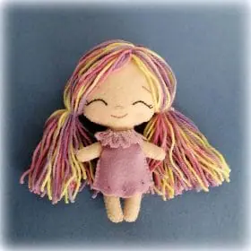 Felt doll made in chibi style, dressed in a lilac dress and panties. Multi-colored hair made from acrylic yarn. Height 12 cm.