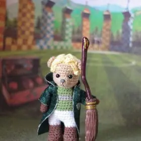 Draco Malfoy in a Quidditch uniform.