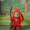 Ginny's toy in a Quidditch uniform. Teddy bear.