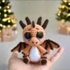 Plush crochet baby dragon amigurumi toy, handmade fantasy creature pattern