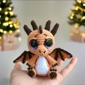 Plush crochet baby dragon amigurumi toy, handmade fantasy creature pattern