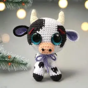 Plush crochet cow amigurumi toy, handmade farm animal pattern