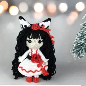 Plush crochet Yuki doll amigurumi toy in a white and red dress, inspired by Japanese folklore, handmade pattern