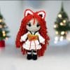 Plush crochet Kitsune doll amigurumi toy named Aki, inspired by Japanese folklore, handmade pattern