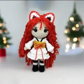 Plush crochet Kitsune doll amigurumi toy named Aki, inspired by Japanese folklore, handmade pattern