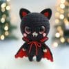 Plush crochet vampire kitten amigurumi toy, handmade Halloween pattern