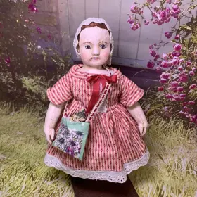 Tiny 9" Izanne Walker style doll in pink dress with cat in shoulder bag.