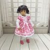 Dress for Little Darling dolls with a heart pattern