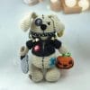 Plush crochet spooky dog amigurumi toy, Halloween-themed handmade pattern.