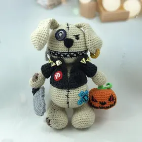 Plush crochet spooky dog amigurumi toy, Halloween-themed handmade pattern.